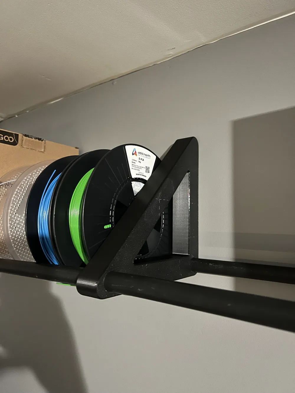 Filament Rack Side View Filament rack with filament text on side by SebbeSpetz - MakerWorld