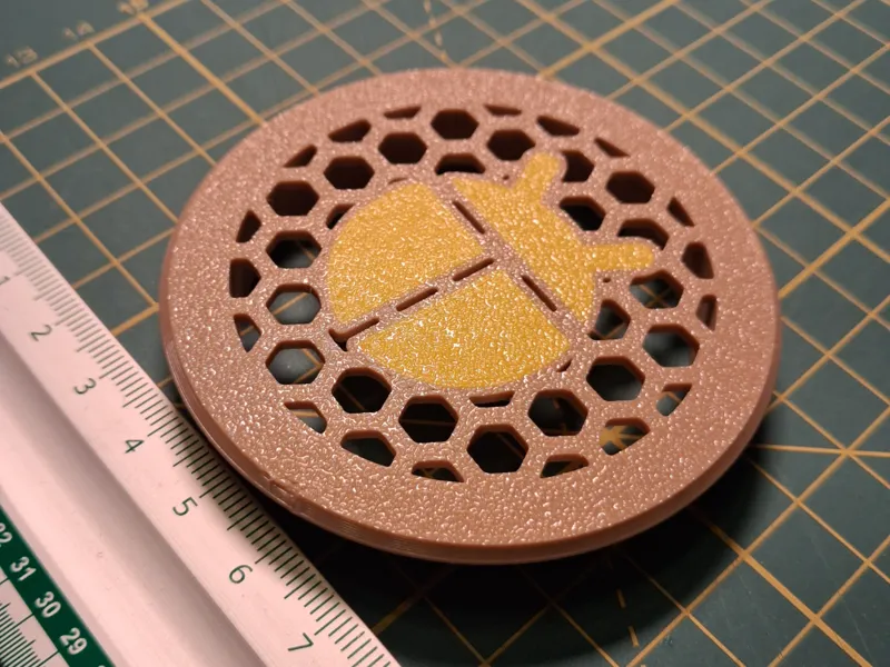 desk grommet 60mm with ladybug icon on honeycomb
