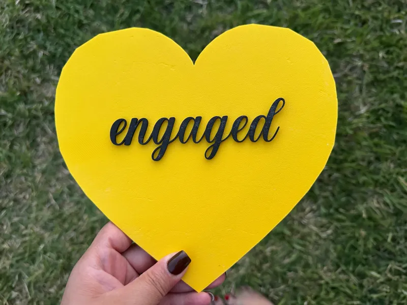 “Engaged” cake topper
