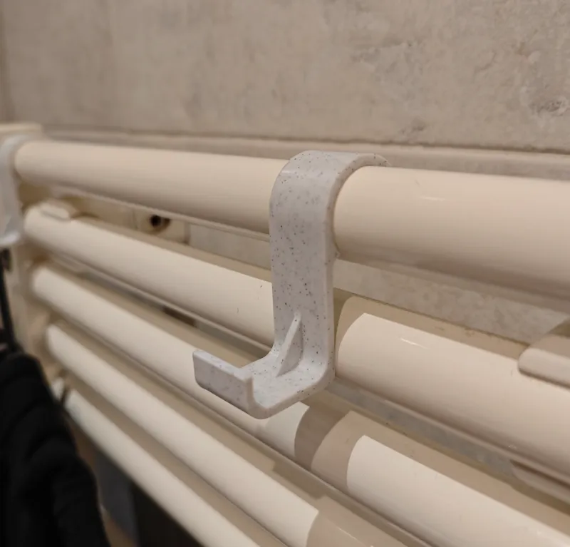 Towel and clothes hanger for heater