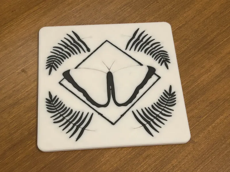 Geometric Butterfly Coaster with Fern Accents