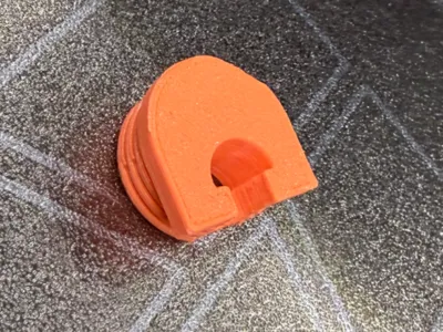 Furniture panel screw retainer