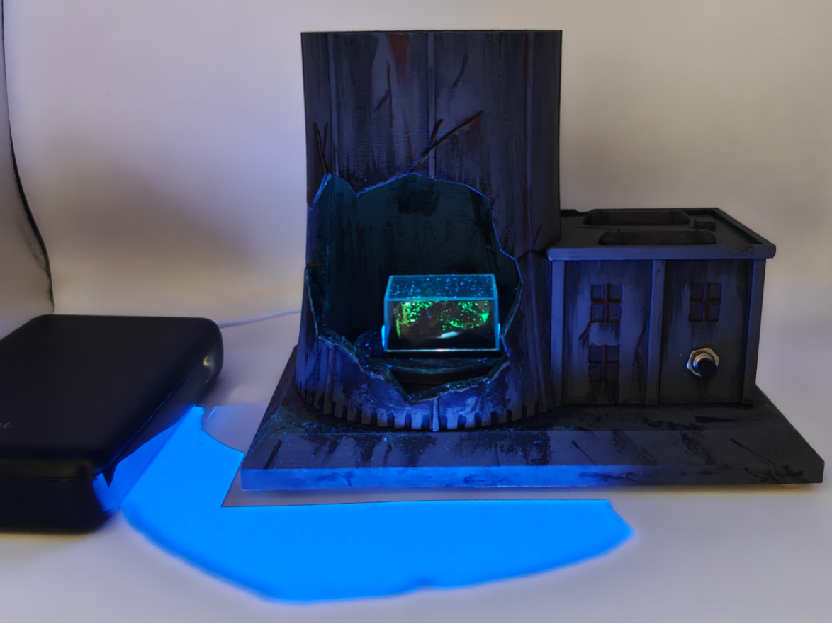 Exploded nuclear reactor diorama with UV light