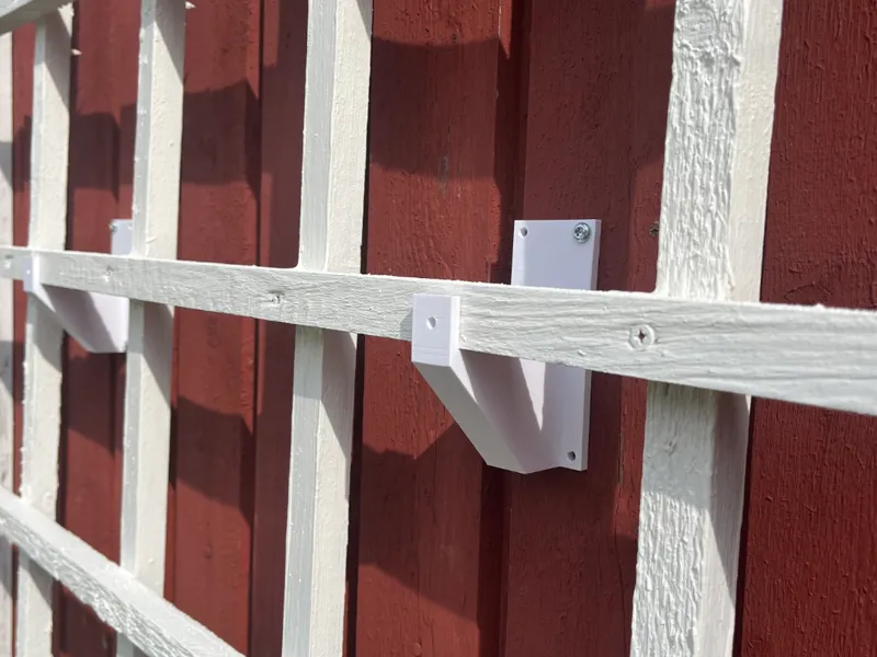 Hanger for trellis.