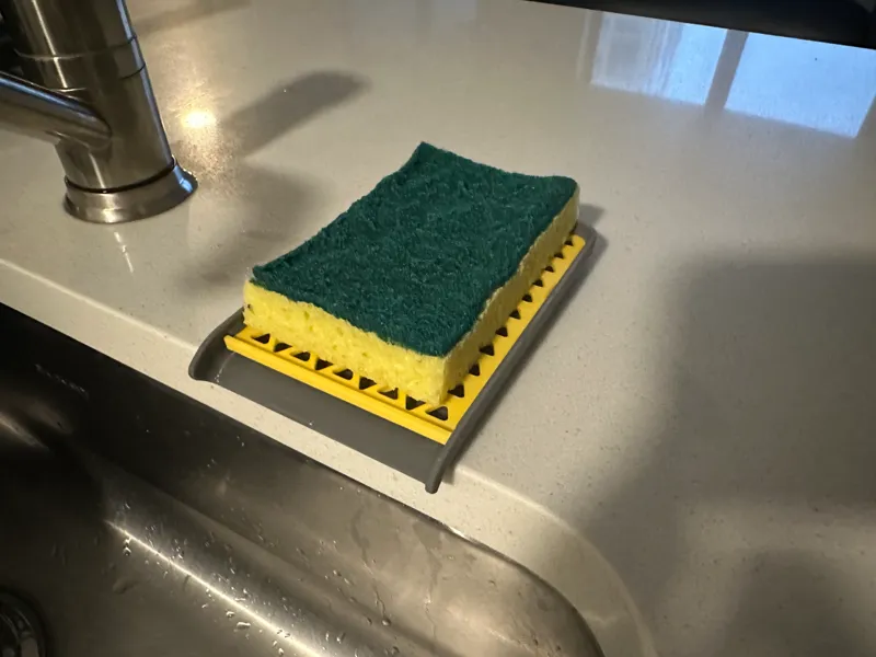 Dish sponge tray for edge of sink