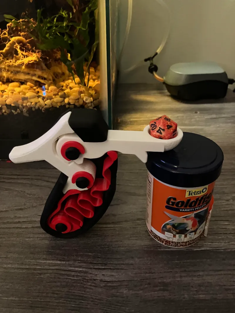 catapult attachment for cock and pull fidget toy