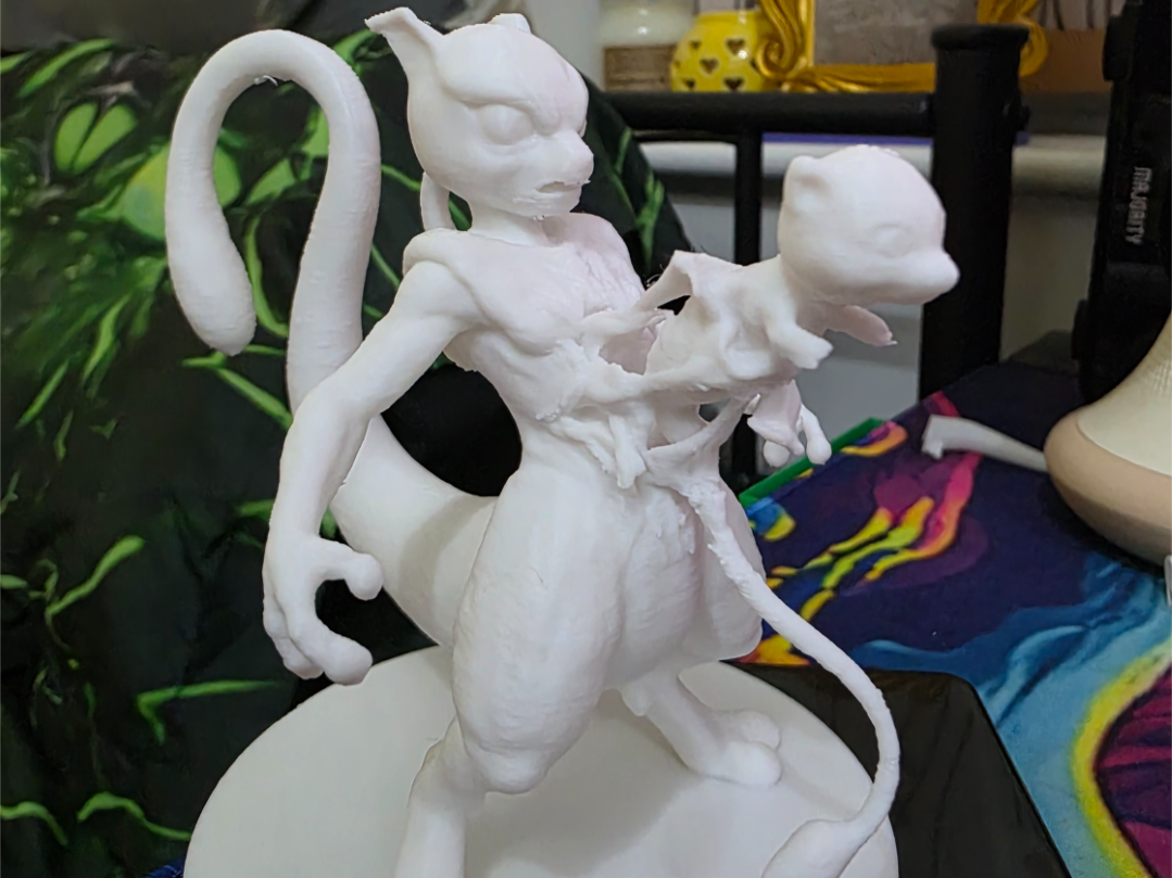 mew coming out of mewtwos chest statue