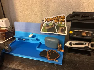 Bedside phone holder/pocket unloader