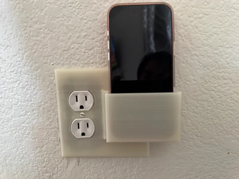 outlet cover with phone holder
