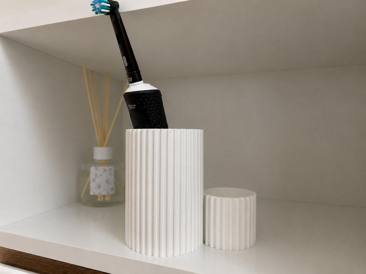 A modern container for toothbrushes and toothpaste