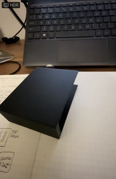 Wall mount laptop charger holder