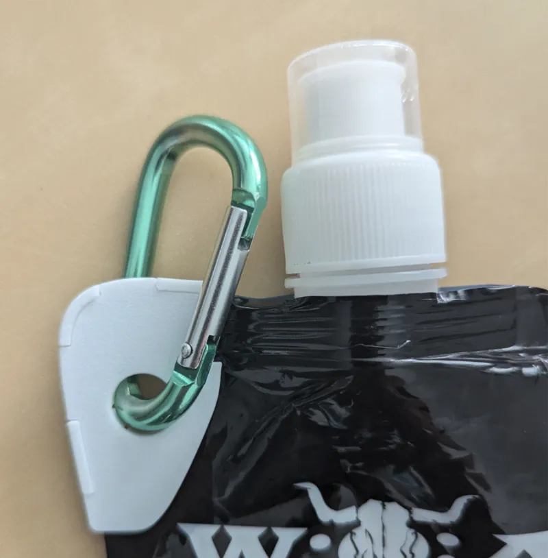 Carabine reenforcement clip for festival water bag