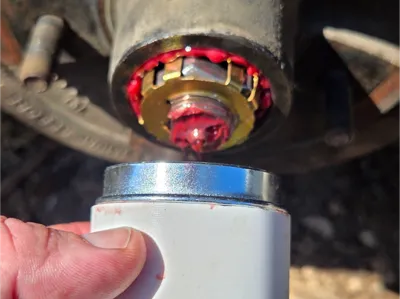 Axle dust cover tool