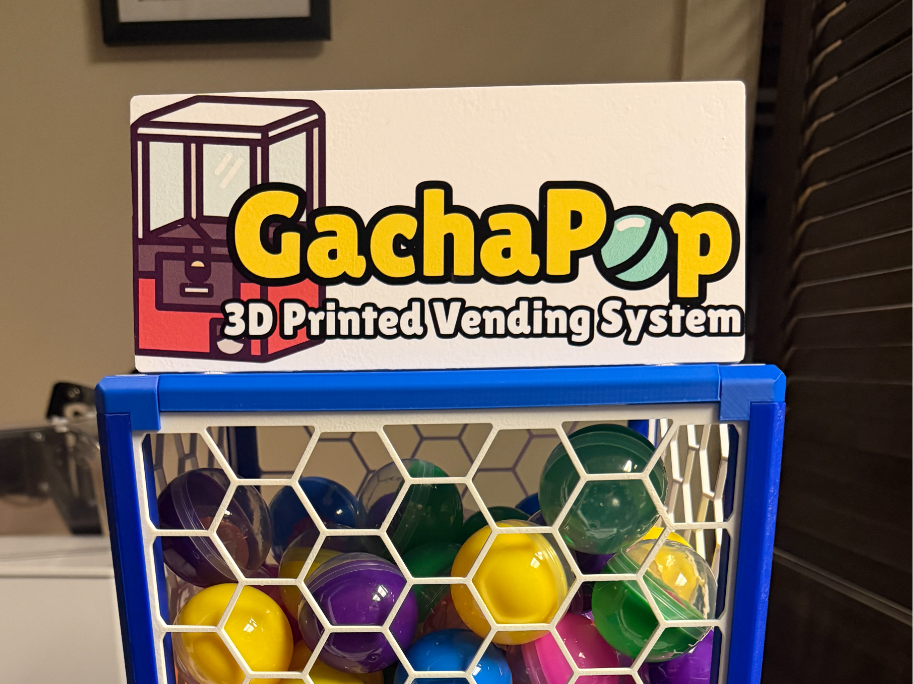 Top mounted sign holder for the GachaPop