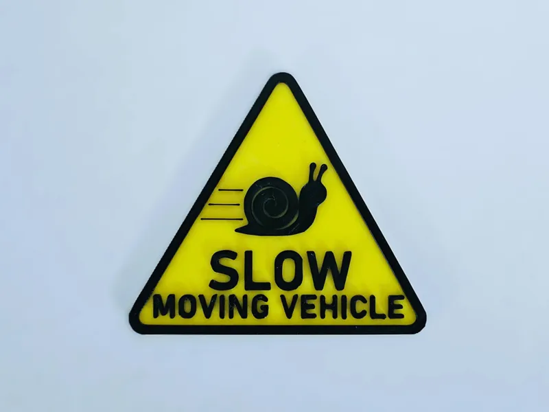 Slow vehicle snail sign
