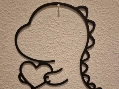 Wall art of a cute Dino holding a heart