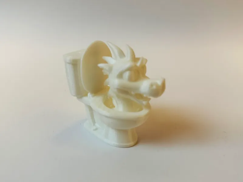 Dragon peeks out of toilet