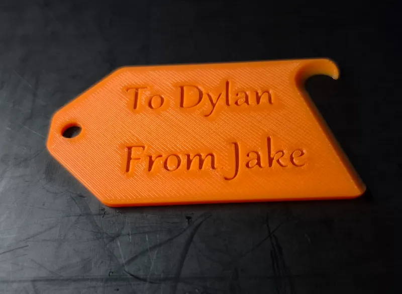 gift tag with built-in wrapping paper cutter