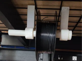 Spool Hanger for shelving rack