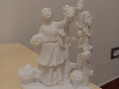 Nativity figurine (woman collecting grapes)