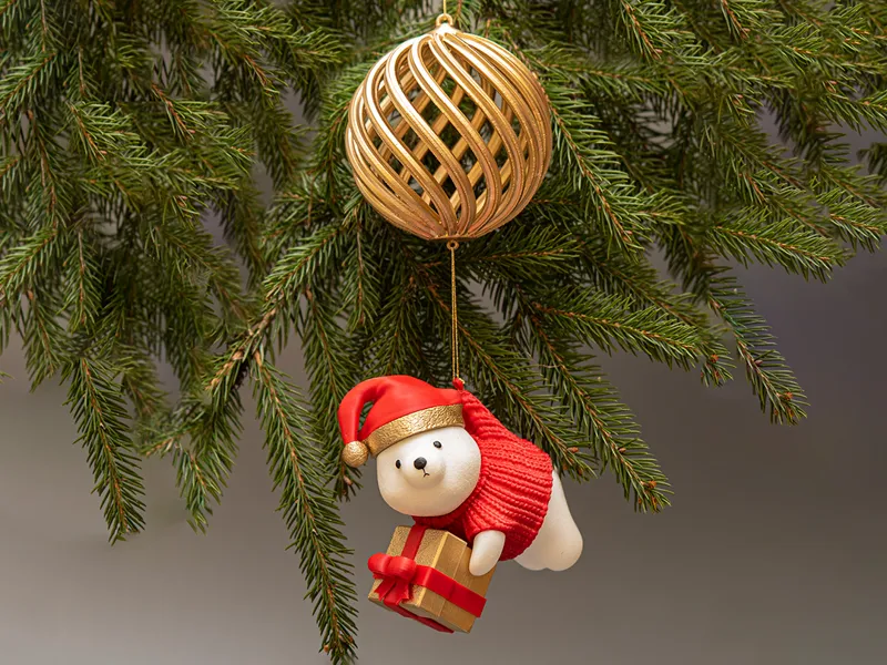 Cute figure of christmas bear with gift box 
