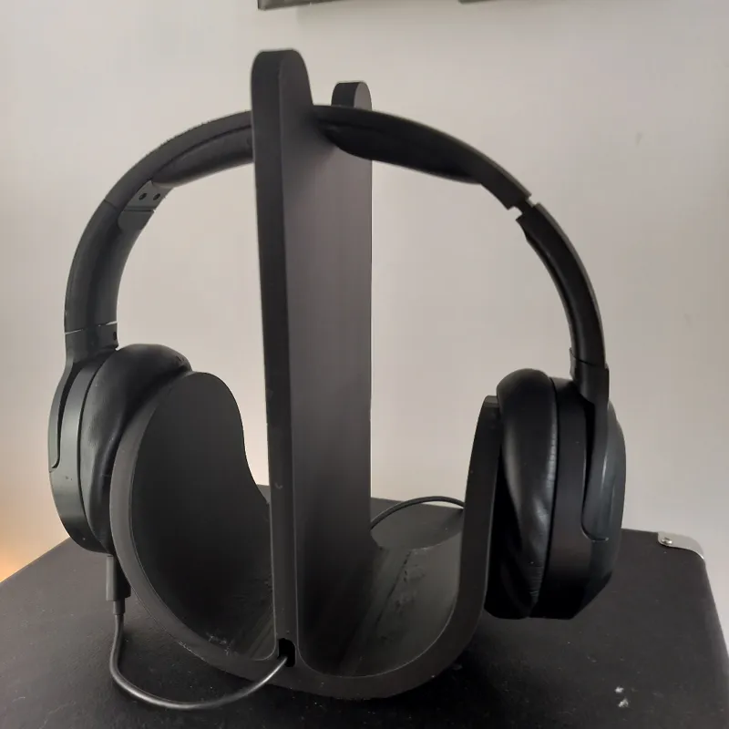 Headphone stand with integrated cable guide.