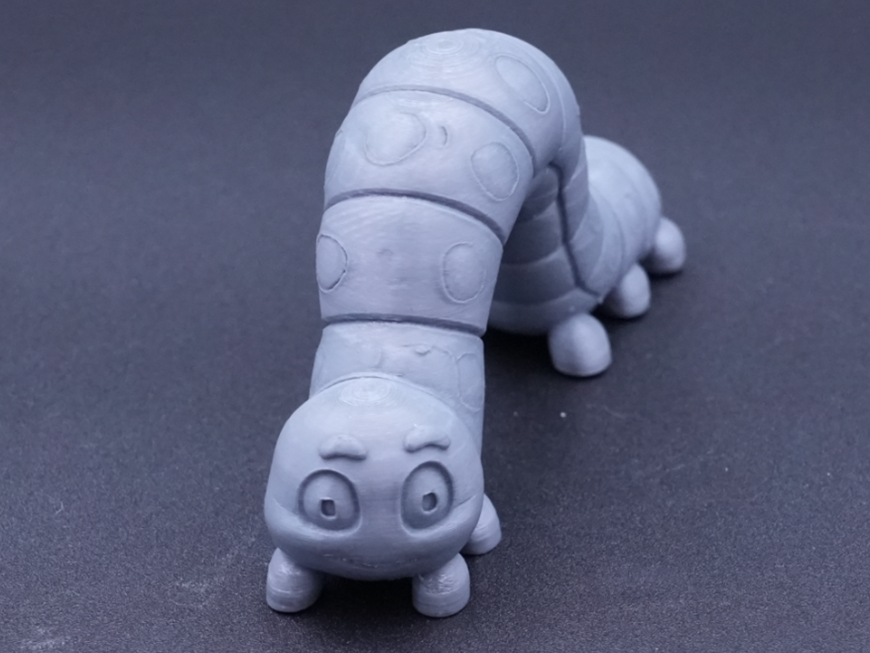 Small model of an inch worm just inching along.