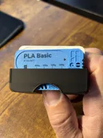 Case 2 mm. wider with a slot for easy removal of the cards