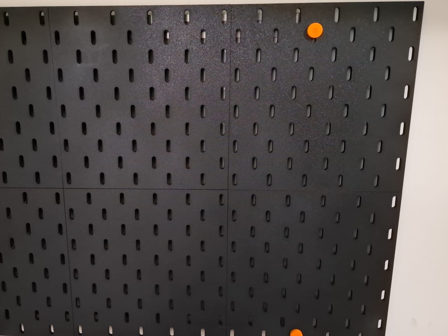 Modular wall accessories holder skadis