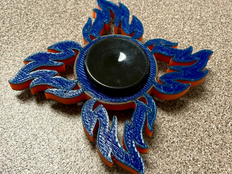 Fidget spinner with flame