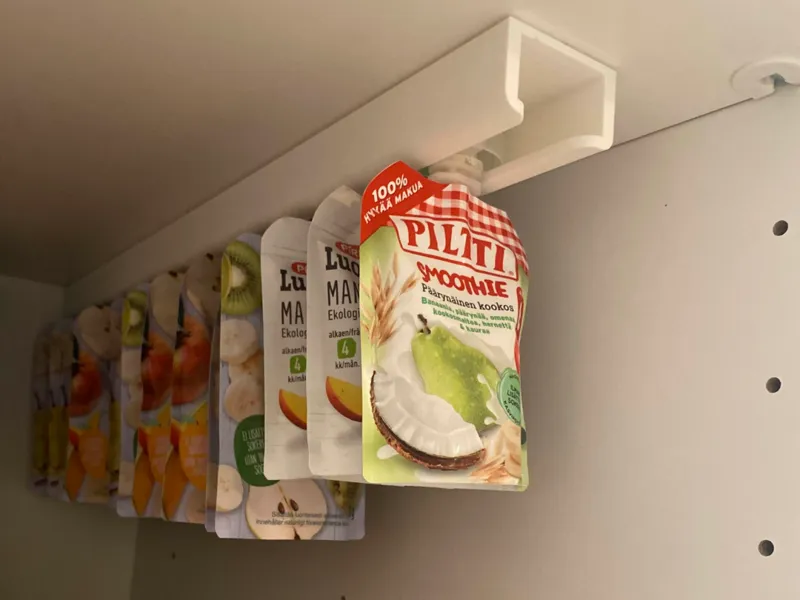 Fruit pouch rail/holder for pantry