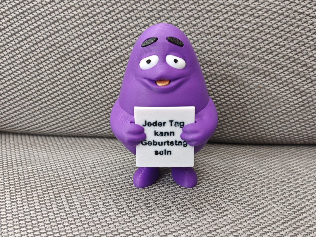Grimace mit Schild