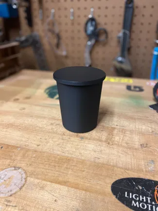 Cupholder trash can with flip top and snap
