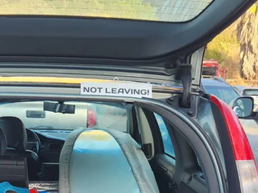 "NOT LEAVING" sign for parking lots