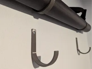 Fly fishing rod tube wall hooks