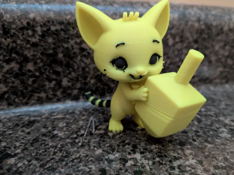 Kitten with dreidel