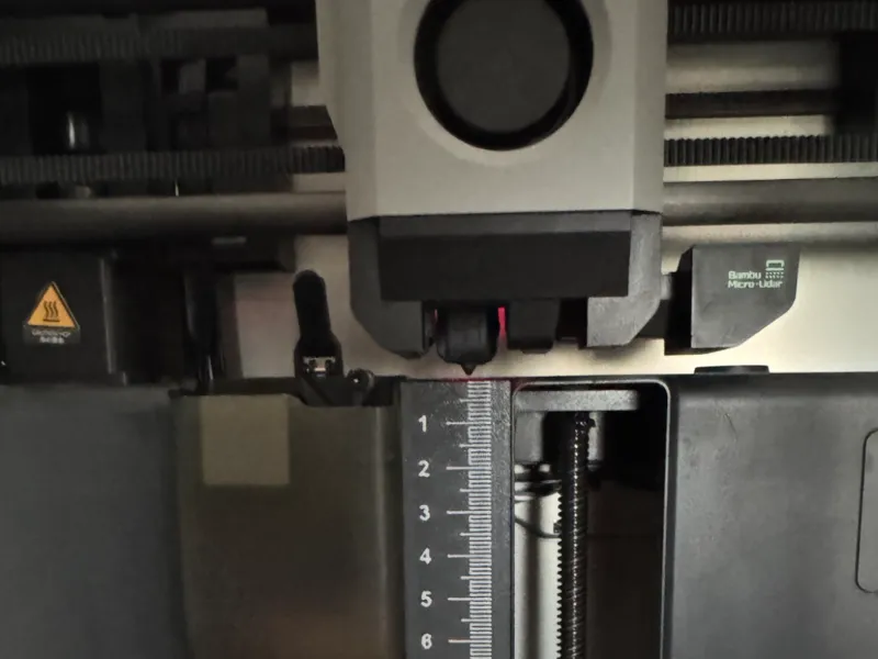 Poop chute cover with ruler