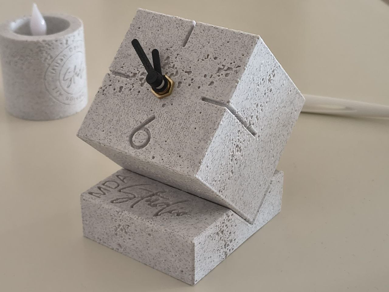 Monolithic travertine table Clock