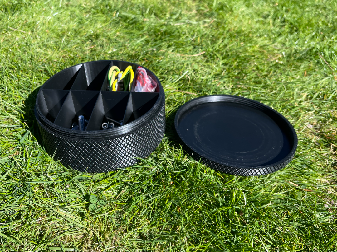 Storage box with screw on lid