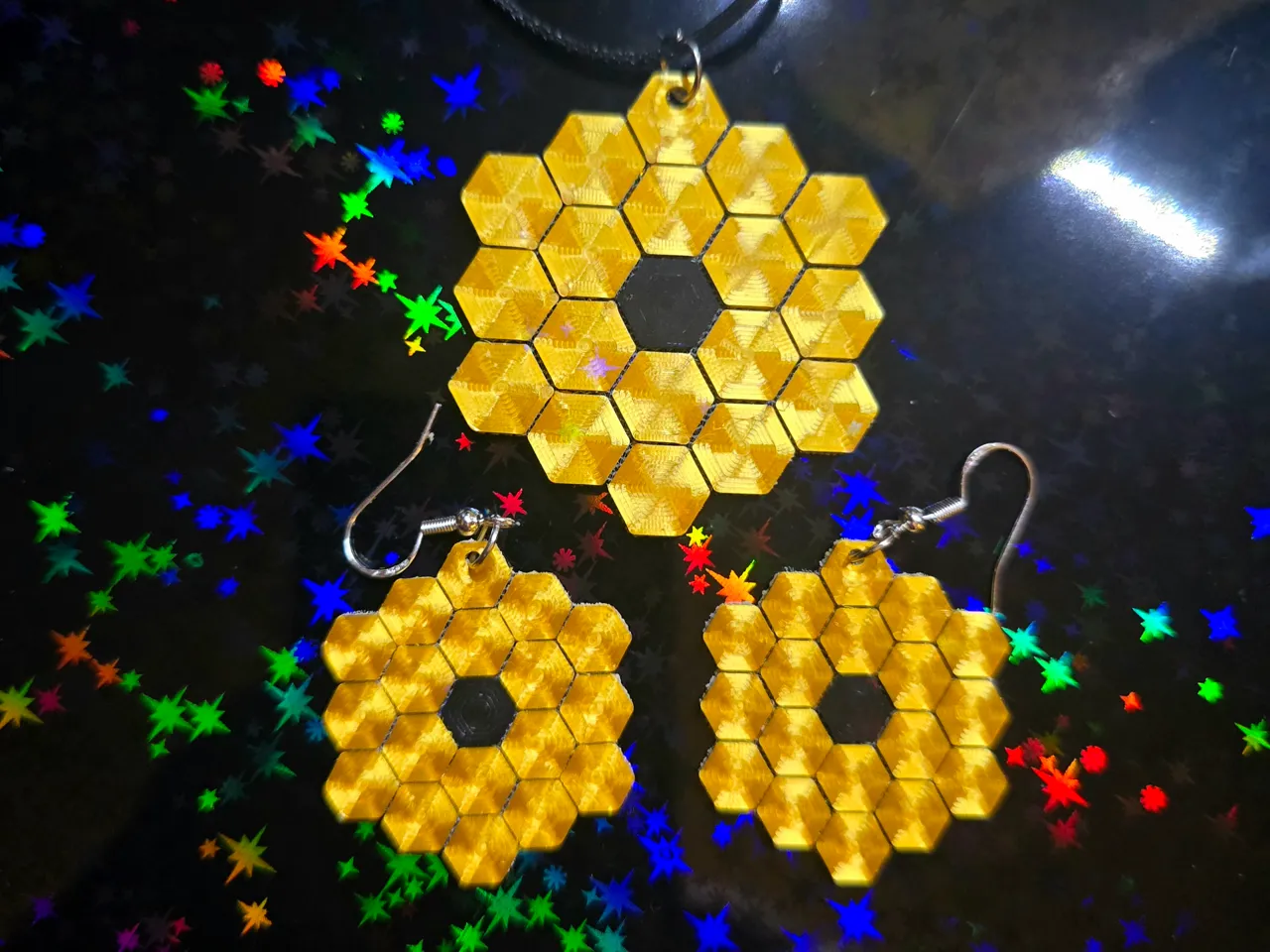 JWST Earrings and Pendant on fabric. view 3