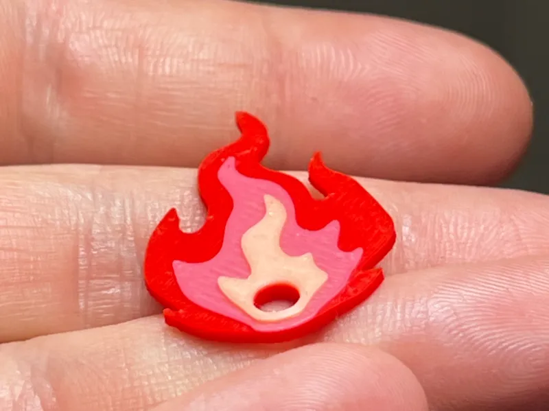 Fire emoji keychain with glow filament