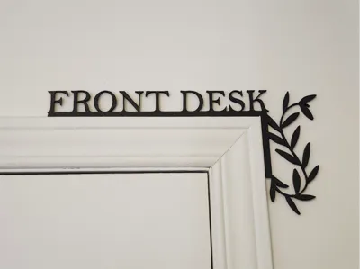 Front Desk door corner sign