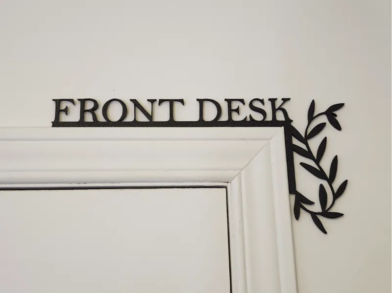 Front Desk door corner sign