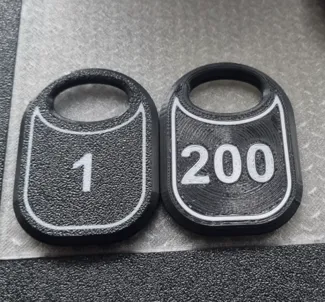 Token (number plate) for the cloakroom.