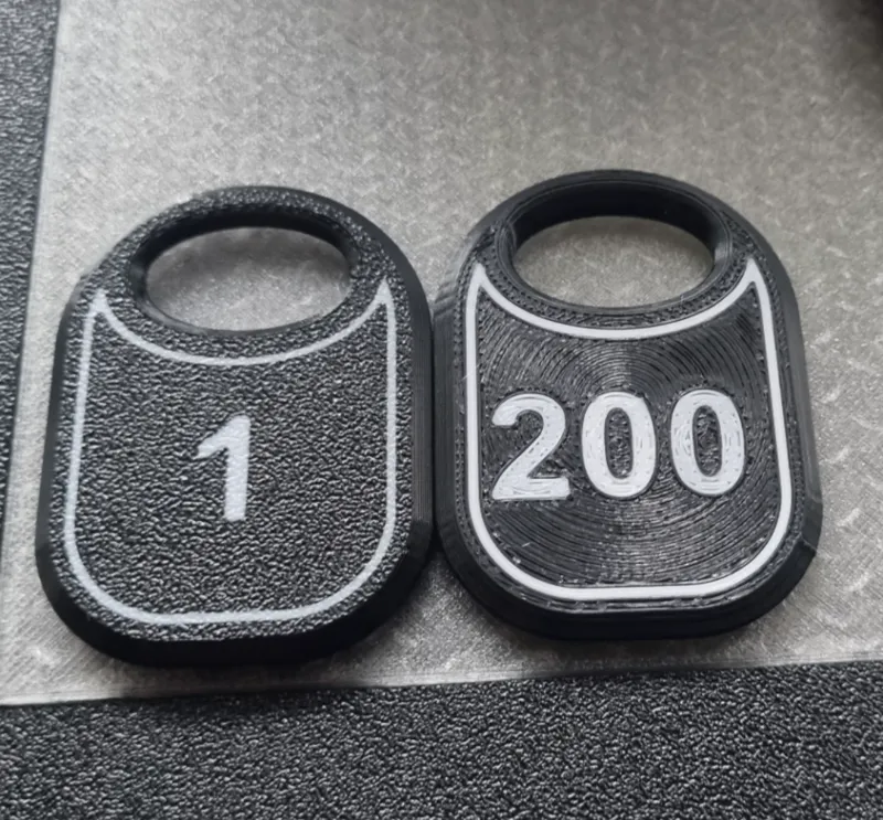 Token (number plate) for the cloakroom.