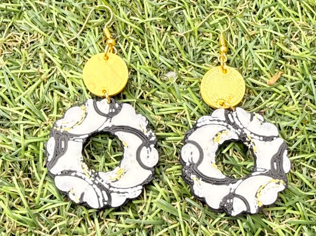 boucles d'oreille fleur noir et or