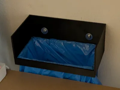 Wall mountable waste catcher using a bag