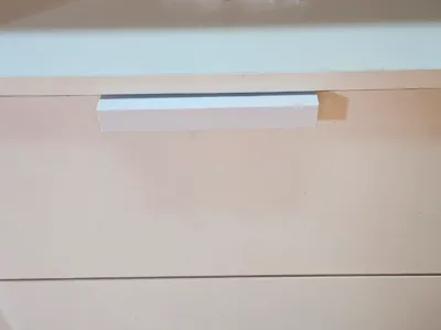 Drawer pull with screw hole