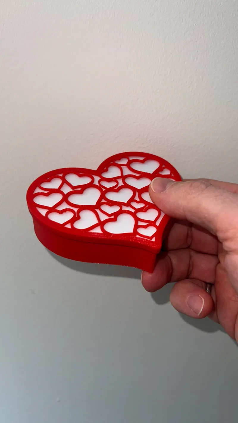 Heart-shaped box with filigree heart-of-hearts lid with optional insert