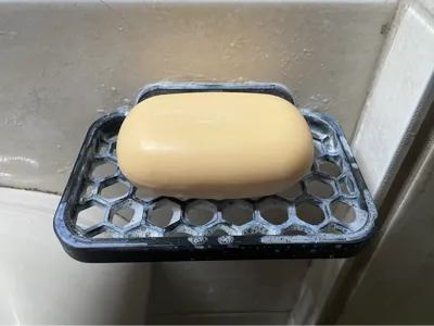 Soap holder with wall mounting hole